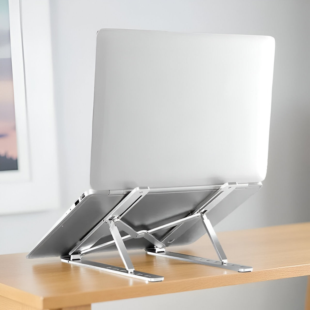 Portable Laptop Stand with 7 Adjustable Levels and Secure Riveted Joints. Features Anti-Slip Silicone Grips, Suitable for laptops 15.6 inches. Easily Foldable for Convenience